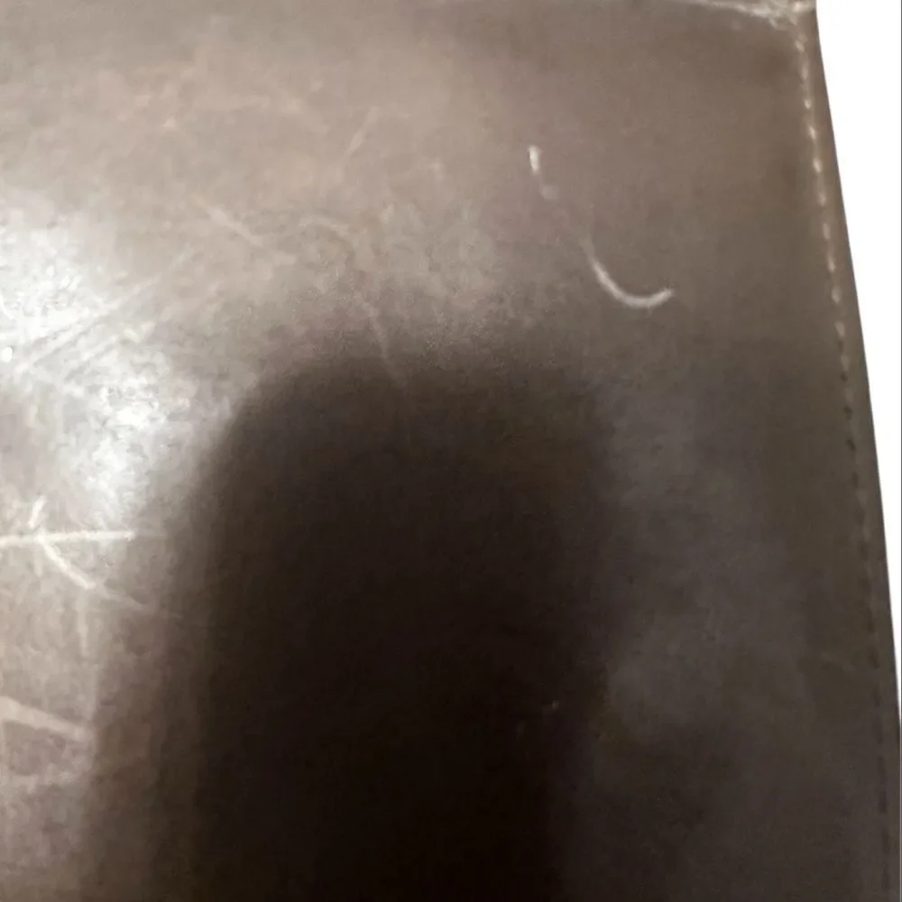 Yves Saint Laurent Tan Leather Wallet with Gold Clasp with marks and scratches.